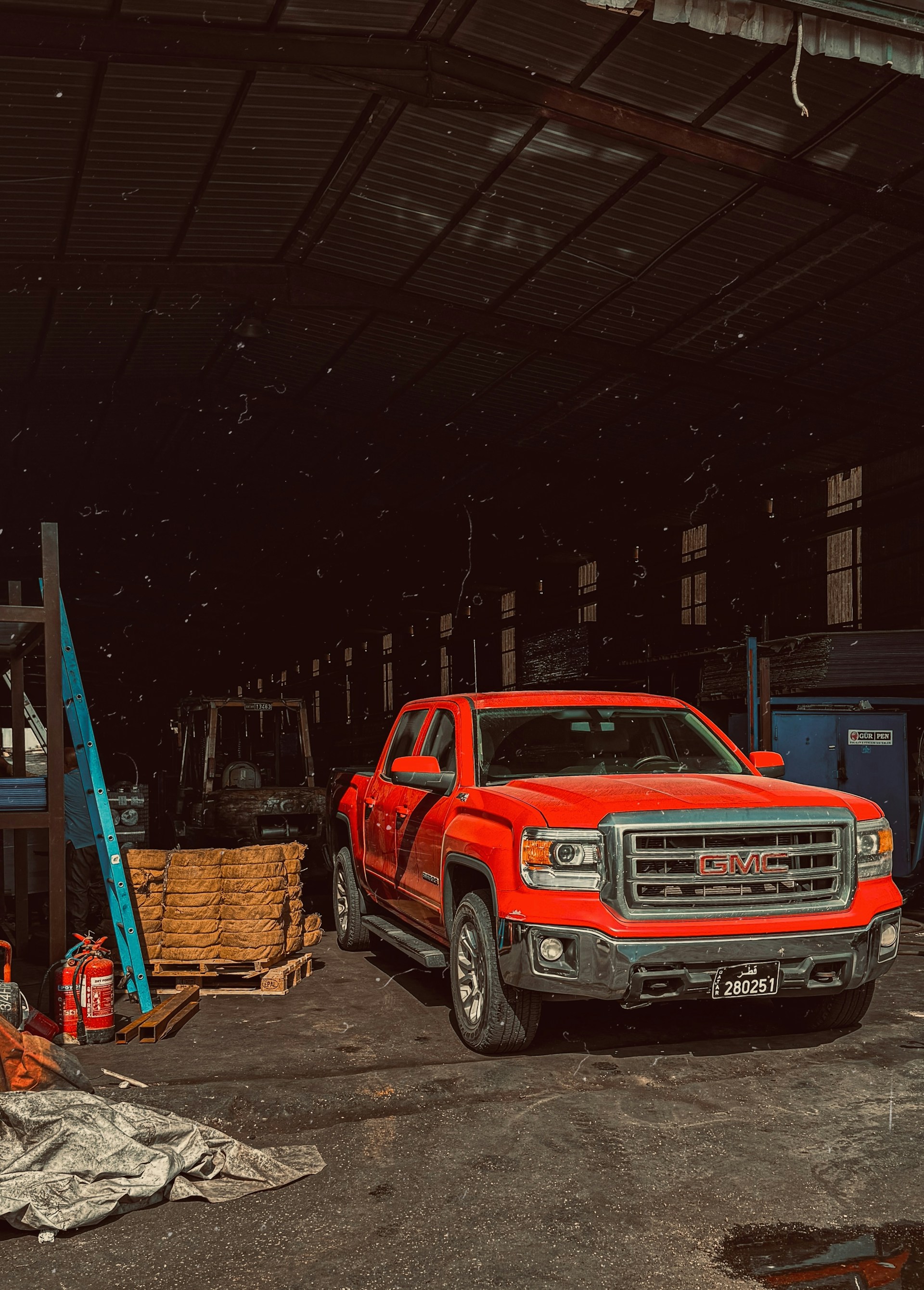 Red truck being serviced in the Shalimar Transmission repair garage